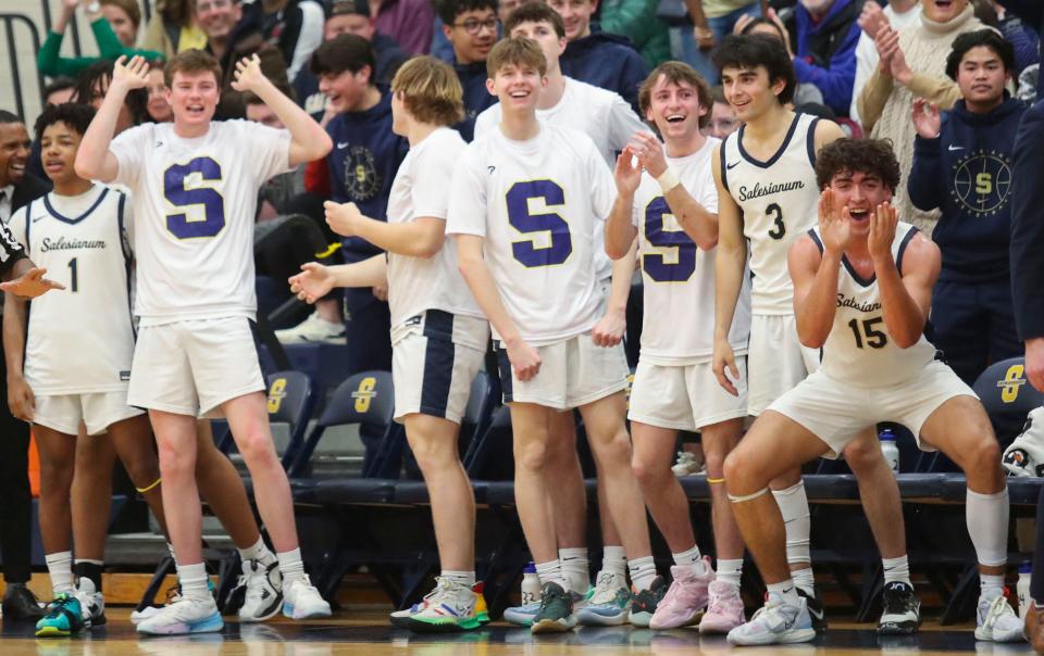 The Sals bench enjoys the festivities as the home team pulls away in a 72-53 win against Polytech in the second round of the DIAA high school state tournament, Thursday, March 2, 2023.