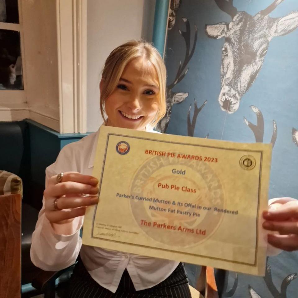 Lancashire Telegraph: Parkers Arms customer Harriet Bentley with The Parkers Arms' British Pie Awards certificate