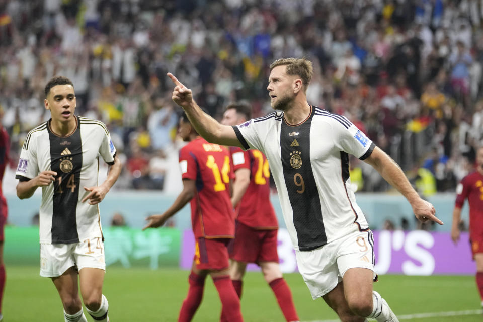 Germany's Niclas Fuellkrug celebrates after he scored his side's first goal during the World Cup group E soccer match between Spain and Germany, at the Al Bayt Stadium in Al Khor , Qatar, Sunday, Nov. 27, 2022. (AP Photo/Luca Bruno)