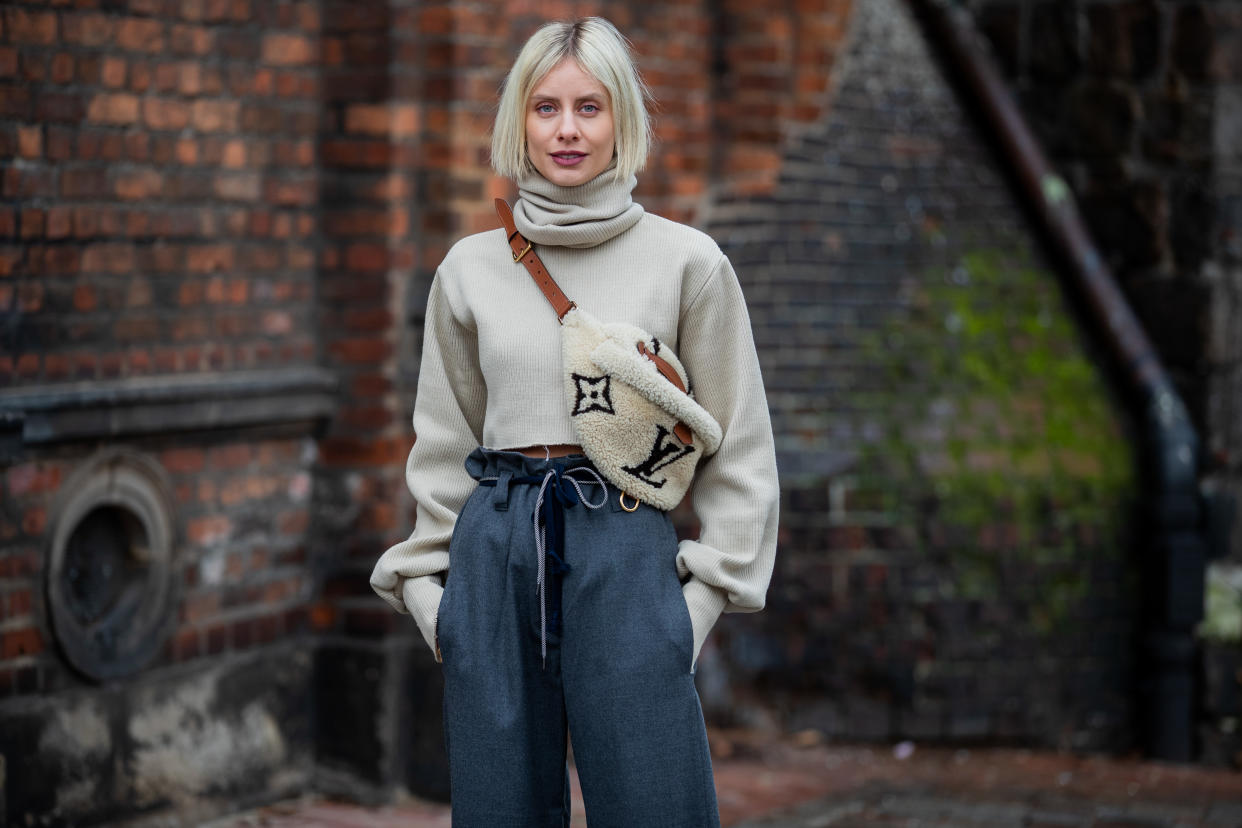 BERLIN, GERMANY - JANUARY 14: Lisa Hahnbueck is seen wearing cropped turtleneck Orse & Iris, grey paperbag pants Odeeh, Louis Vuitton shearling bumbag during the Berlin Fashion Week Autumn/Winter 2020 on January 14, 2020 in Berlin, Germany. (Photo by Christian Vierig/Getty Images)