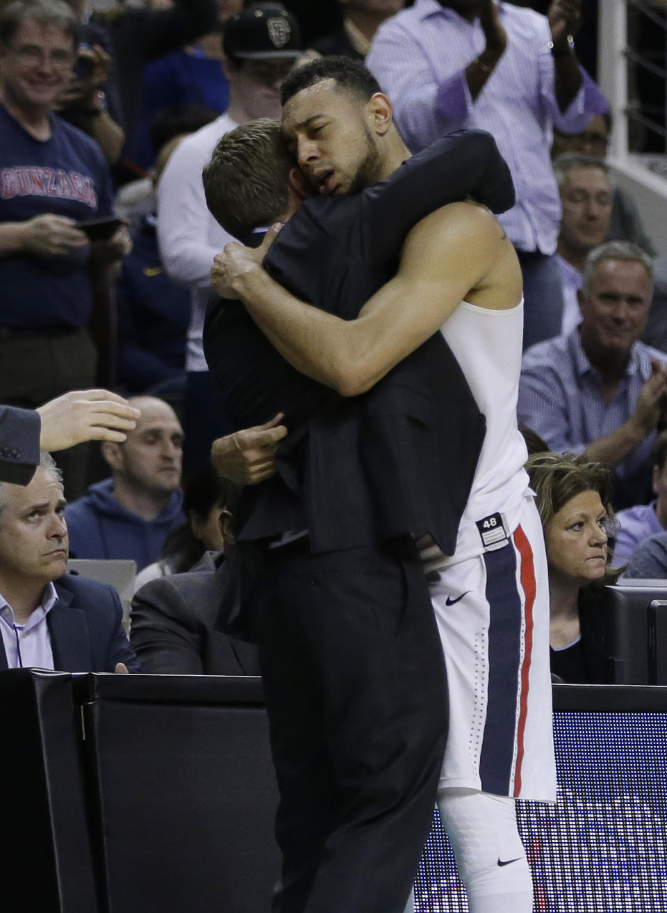 Gonzaga guard Nigel Williams-Goss, right, is hugged by head coach Mark Few in the closing minutes before a win over Xavier during an NCAA Tournament college basketball regional final game Saturday, March 25, 2017, in San Jose, Calif. (AP Photo/Ben Margot)