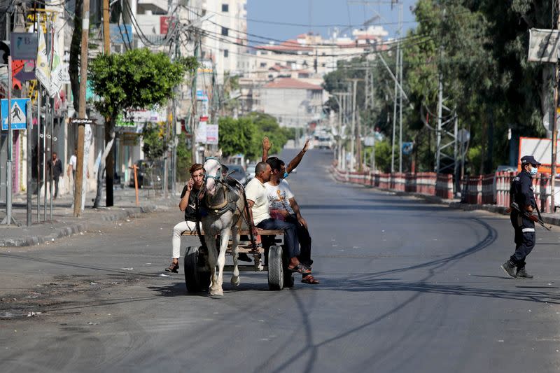 Gaza reports first COVID-19 cases outside quarantine areas, declares lockdown