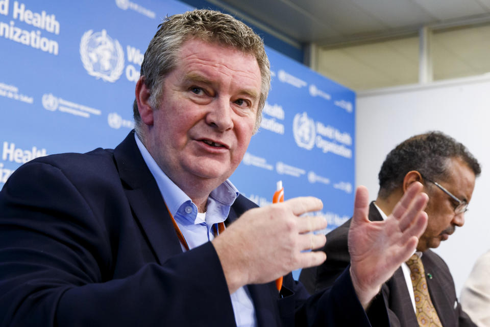 FILE - In this Feb. 5, 2020, file photo, Dr. Michael Ryan, executive director of the World Health Organization's Health Emergencies program, speaks during a news conference at the WHO headquarters in Geneva, Switzerland. At right is WHO Director-General Tedros Adhanom Ghebreyesus. As the World Health Organization draws up plans for the next phase of its probe of how the coronavirus pandemic started, an increasing number of scientists say the U.N. agency it isn’t up to the task and shouldn’t be the one to investigate. Ryan said that the agency was working out the final details of the next phase of its probe and that because WHO works “by persuasion,” it lacks the power to compel China to cooperate. (Salvatore Di Nolfi/Keystone via AP, File)