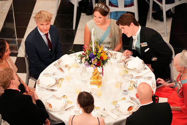 <p>MADS CLAUS RASMUSSEN/Ritzau Scanpix/AFP via Getty</p> Princess Ingrid Alexandra of Norway and Prince Christian of Denmark sit together during his 18th birthday gala on October 15