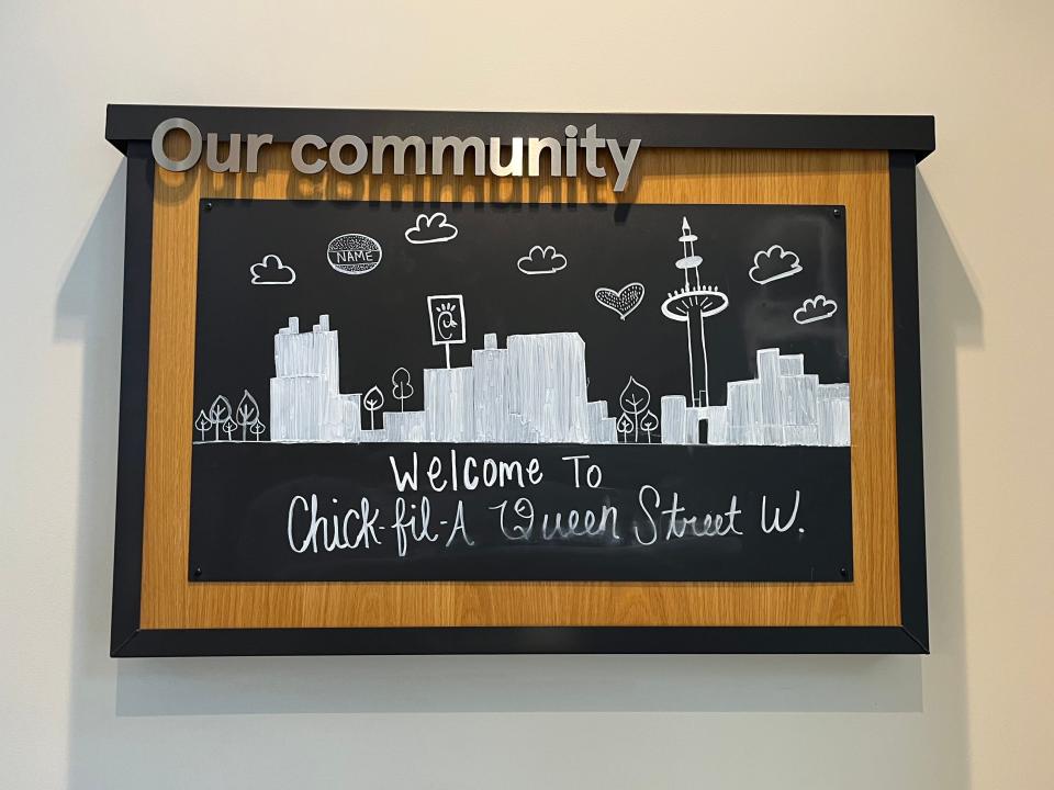chalkboard sign at a chick fil a in toronto on queen street west