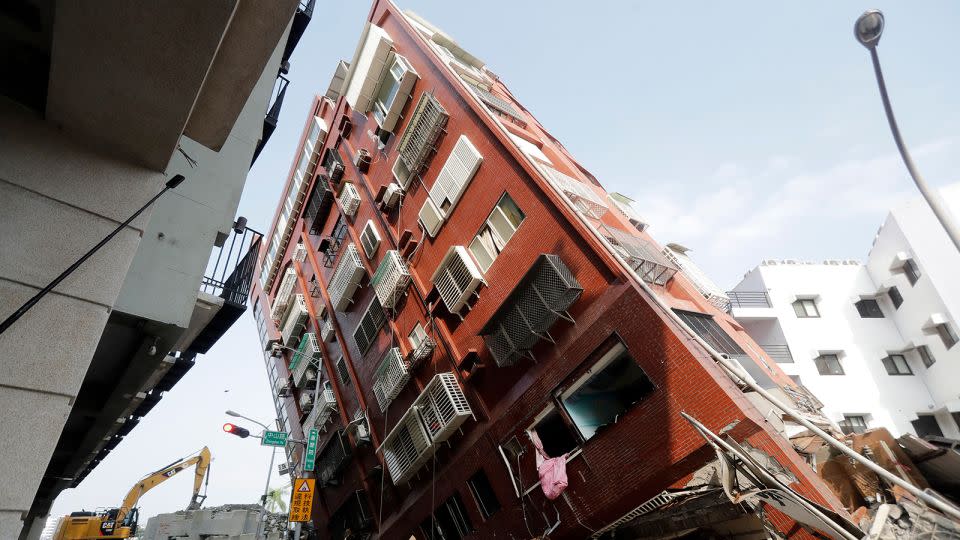 Debris surrounds a titled building a day after a powerful earthquake struck in Hualien City, eastern Taiwan, Thursday, April 4, 2024. - ChiangYing-ying/AP