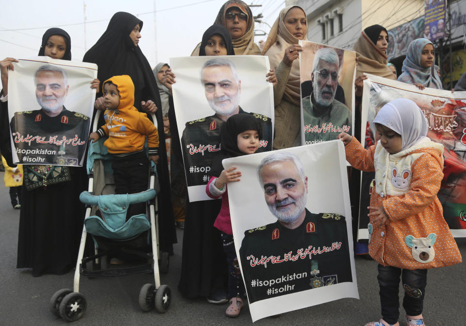 Pakistani Shiite Muslims demonstrate over the U.S. airstrike in Iraq that killed Iranian Revolutionary Guard Gen. Qassem Soleimani, near the U.S. Consulate in Lahore, Pakistan, Friday, Jan. 3, 2020. Iran has vowed 