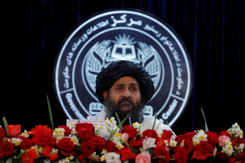 FILE PHOTO: News conference held by Afghan Deputy PM Mullah Abdul Ghani Baradar and Wang Yu, China's ambassador in Kabul