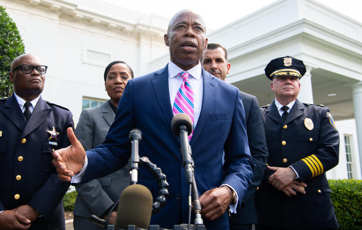 Outside the White House, Eric Adams addresses the media alongside local and law enforcement officials.