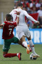 <p>Morocco’s Hakim Ziyach fouls Portugal’s Cristiano Ronaldo </p>