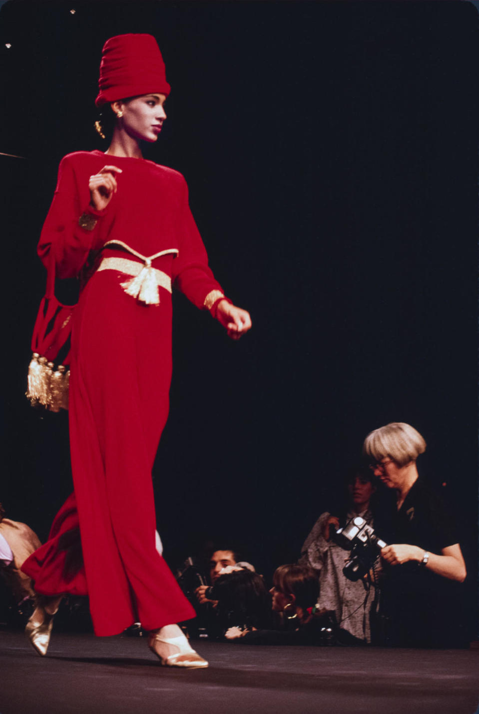 A model wears a red tasseled suit at Sonia Rykiel’s spring 1989 show in Paris.