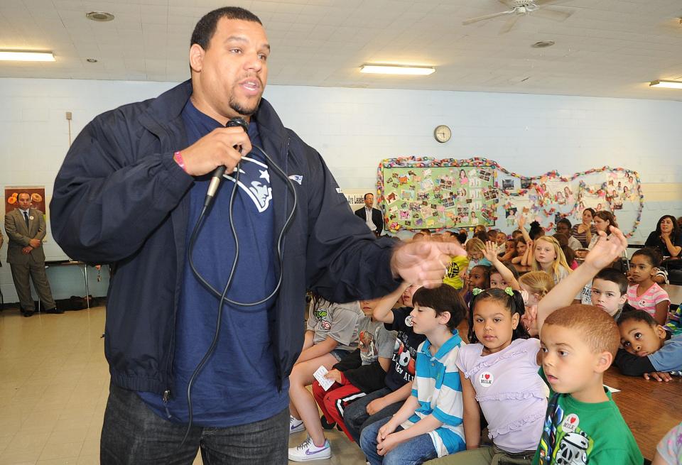 Jermaine Wiggins speaks to students at Brookfield Elementary School in Brockton on Wednesday, June 12, 2013