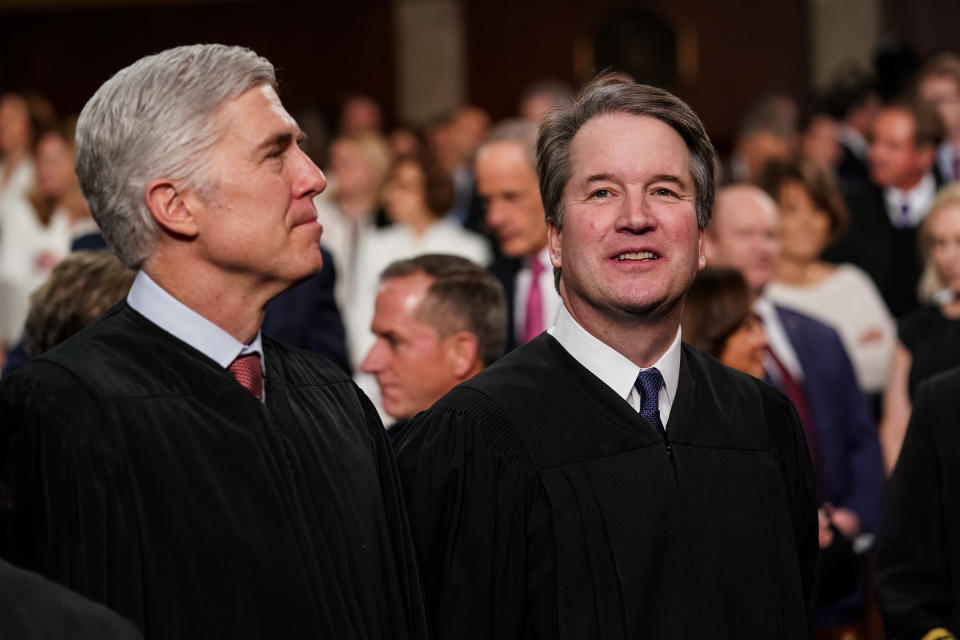 Neil Gorsuch, associate justice of the U.S. Supreme Court, left, and Brett Kavanaugh, associate justice of the U.S. Supreme Court, attend the U.S. President Donald Trump's State of the Union address to a joint session of Congress at the U.S. Capitol in Washington, D.C., U.S., on Feb. 5, 2019. (Photo: Doug Mills/Pool via Bloomberg/Getty Images)