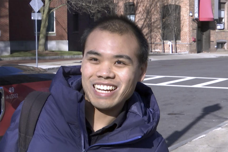 In this Jan. 31, 2019, photo, Lele Luan talks during an interview on the Northeastern University campus in Boston. As concerns about China's virus outbreak spread, universities all over the world are scrambling to assess the risks to their programs, and some are canceling study-abroad opportunities and prohibiting travel affecting hundreds of thousands of students. At Northeastern University, graduate student Luan said that while some fellow Chinese students have taken to wearing masks around campus, he does not feel the need. (AP Photo/Rodrique Ngowi)