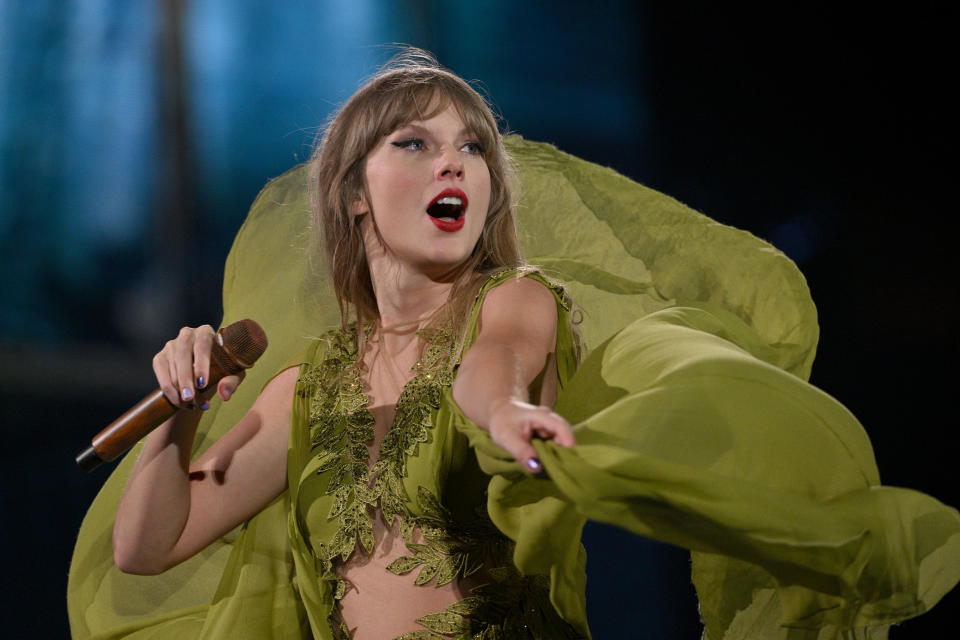 Close-up of Taylor performing onstage