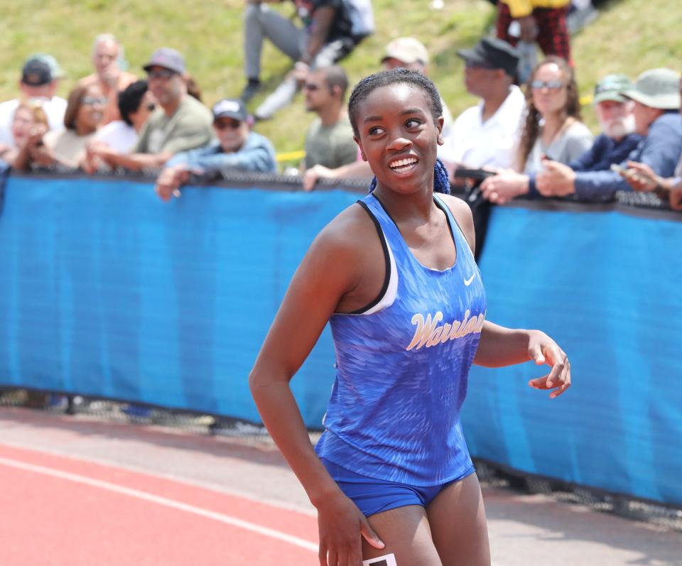 Camryn Cole from Webster Schroeder reacts to her second place finish in the girls 110 meter hurdles division 1, during the New York State Track and Field Championships at Middletown High School, June 10, 2023.