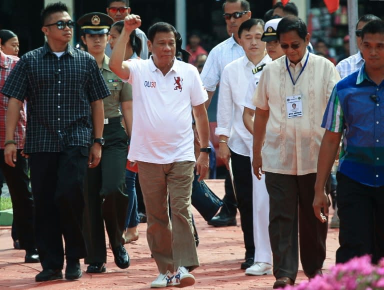 Philippines' president-elect Rodrigo Duterte (C) arrives for the flag raising ceremonmy at the city hall grounds in Davao City, On the southern island of Mindanao, on June 27, 2016