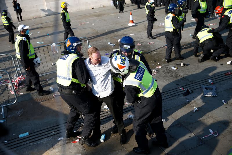 People gather in Trafalgar Square to protest against the lockdown imposed by the government, in London