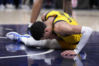 Indiana Pacers guard Tyrese Haliburton reacts after getting injured during the first half of Game 4 against the New York Knicks in an NBA basketball second-round playoff series, Sunday, May 12, 2024, in Indianapolis. (AP Photo/Michael Conroy)