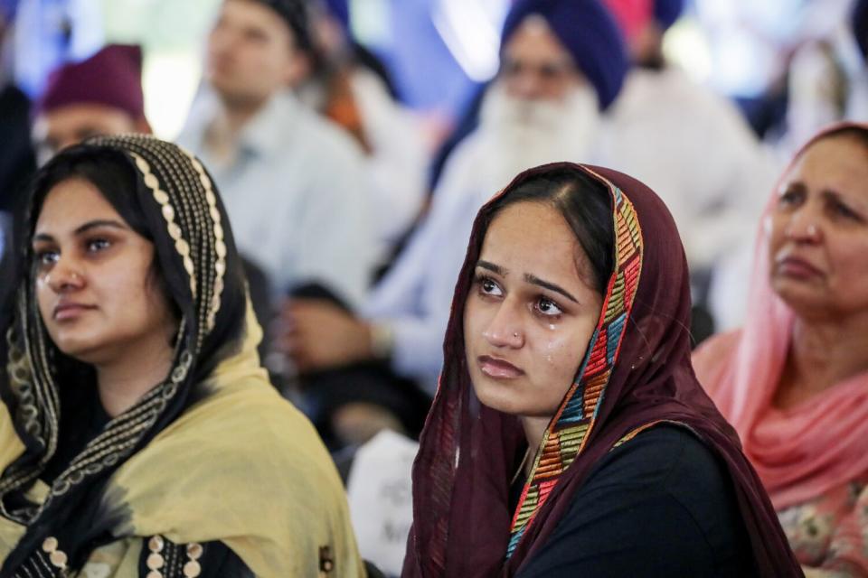 Tears stream down the face of Palmeet Kaur at Sikh Temple of Wisconsin.