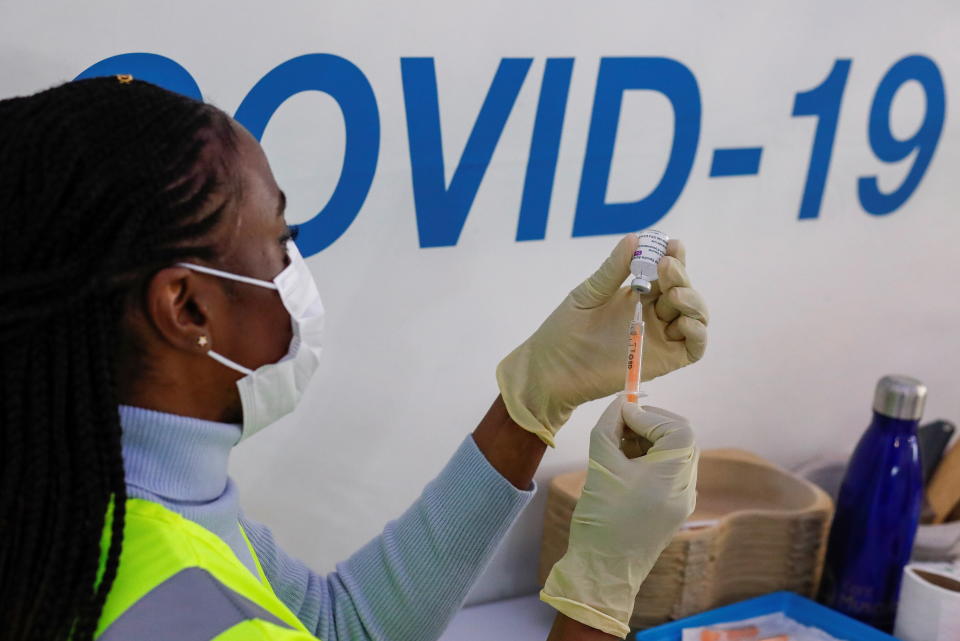 A dose of AstraZeneca vaccine is prepared at A COVID-19 vaccination centre in the Odeon Luxe Cinema in Maidstone. Photo: Andrew Couldridge/Reuters