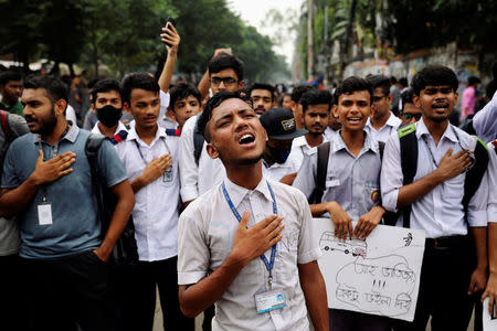 FILE PHOTO: Students sing the national anthem as they take part in a protest over recent traffic accidents that killed a boy and a girl, in Dhaka, Bangladesh, August 4, 2018. REUTERS/Mohammad Ponir Hossain