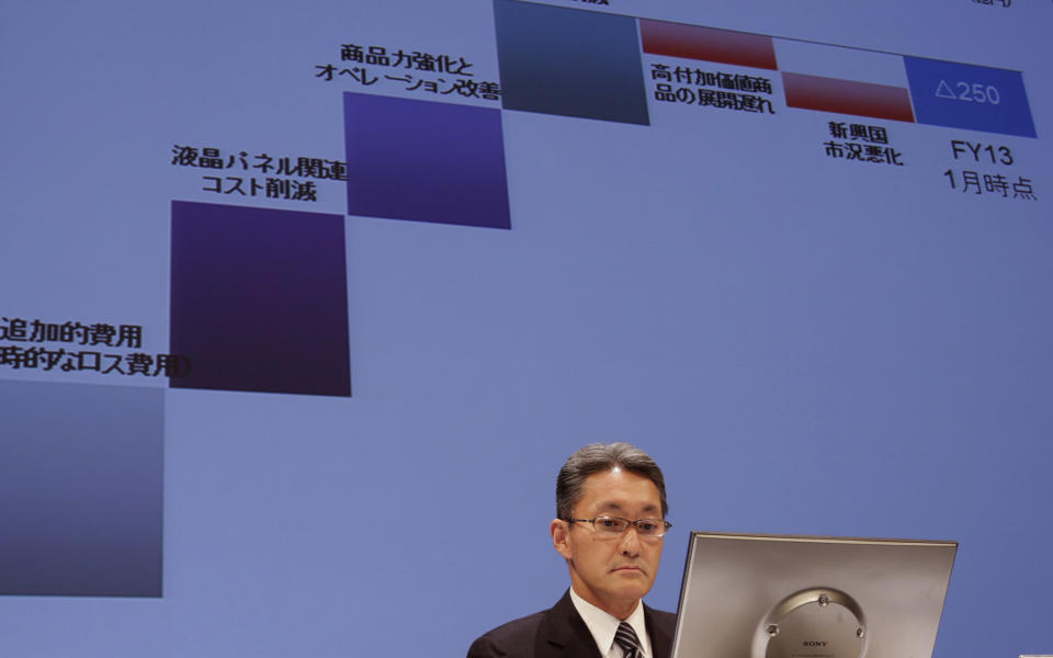 Sony Corporation President and CEO Kazuo Hirai watches a monitor screen during a press conference at the Sony headquarters in Tokyo, Thursday, Feb. 6, 2014. Sony is in talks to sell its troubled personal computer business and Thursday lowered its earnings forecast for the business year ending March to a 110 billion yen loss ($1.1 million).The company also said it's cutting its global workforce by about 3 percent or 5,000 people by the end of March 2015 as it restructures its PC, television and other businesses. (AP Photo/Shizuo Kambayashi)