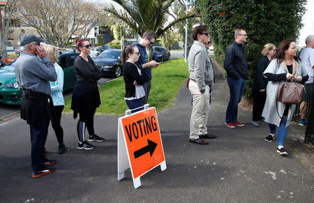 Voters wait outside a polling station at the St Heliers Tennis Club during the general election in Auckland, New Zealand, September 23, 2017. REUTERS/Nigel Marple