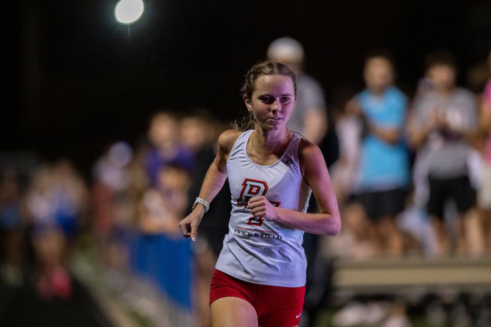 Park Tudor High School’s Sophia Kennedy leads the pack into the first turn during a Flashes Showcase Miracle Mile race, Friday, April 14, 2023, at Franklin Central High School in Indianapolis.