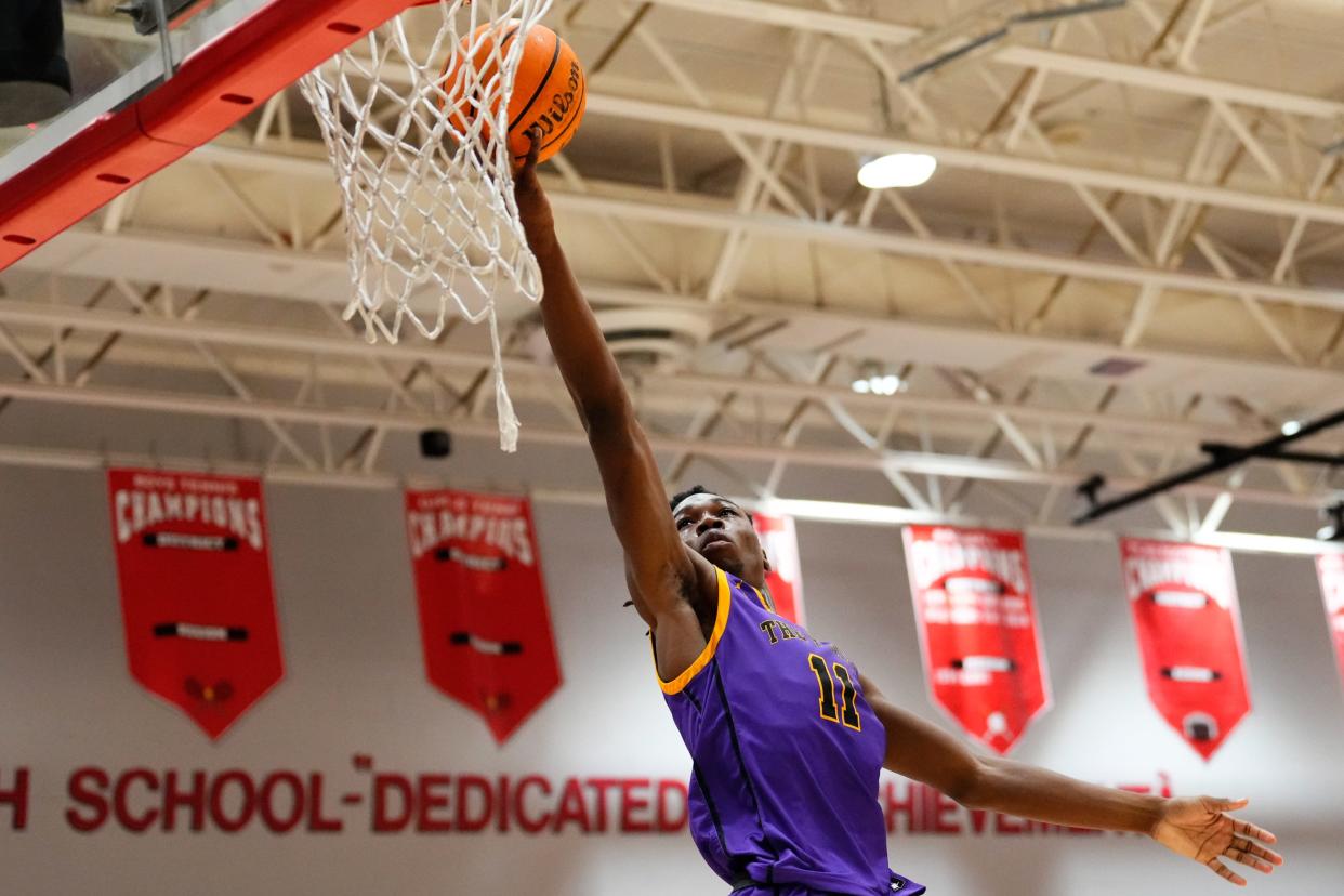 Fort Pierce Central's Joseph Gayle (11) lays up a shot against Post St. Lucie in a boys basketball game, Friday, Jan. 12, 2024, at Port St. Lucie High School.