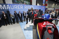 Christine Buffy, center right, president of Carnival Cruise Line's introduces the first roller coaster that will be on a cruise ship with former NBA star and Carnival's chief fun officer, Shaquille O'Neal during the International Association of Amusement Parks and Attractions convention Tuesday, Nov. 19, 2019, in Orlando, Fla. (AP Photo/John Raoux)