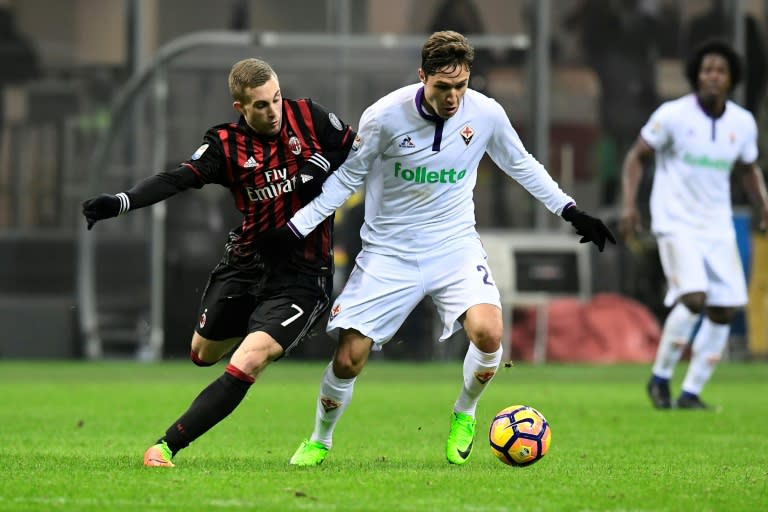 Fiorentina's forward Federico Chiesa (R) clashes with AC Milan's forward Gerard Deulofeu on February 19, 2017