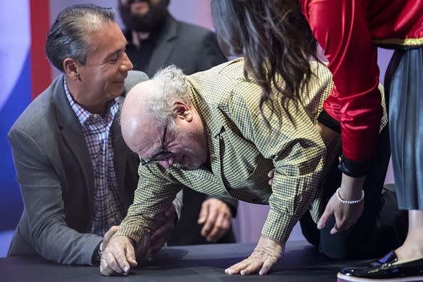 Danny DeVito had to be helped by aides after taking a tumble while attempting to climb stairs. Picture: Getty Images