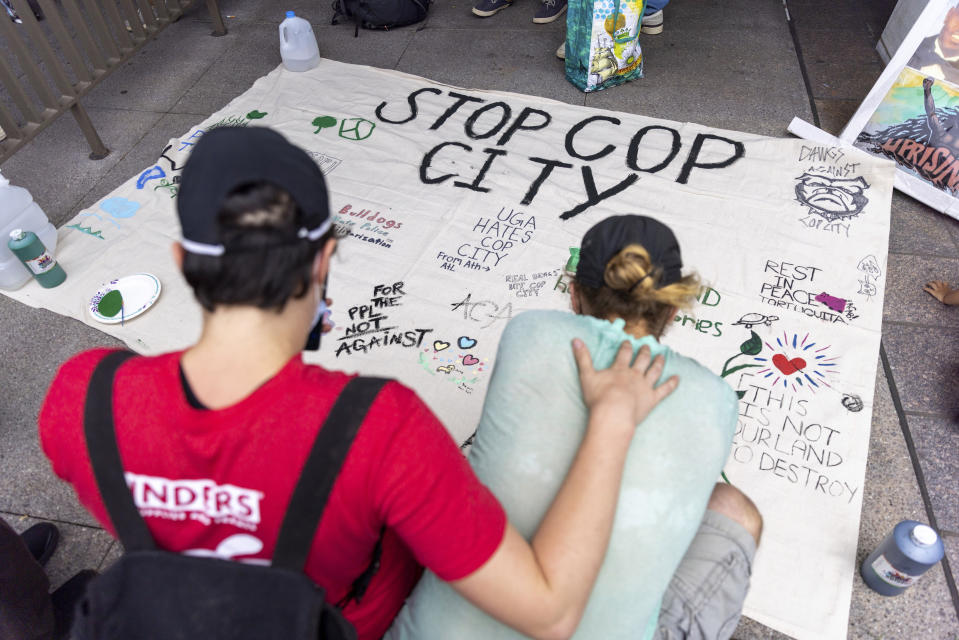 Protesters gather outside Atlanta City Hall ahead of a council vote over whether to approve public funding for the construction of a proposed police and firefighter training center, Monday, June 5, 2023. (Arvin Temkar/Atlanta Journal-Constitution via AP)