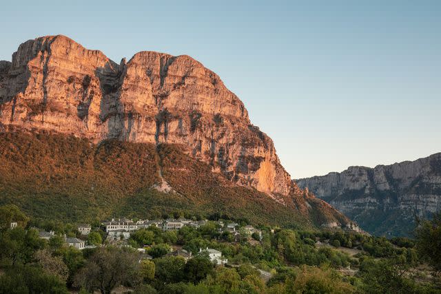 <p>Margarita Nikitaki</p> Sunset in Papingo, one of the 46 villages in northern Greece that make up the Zagorohoria.