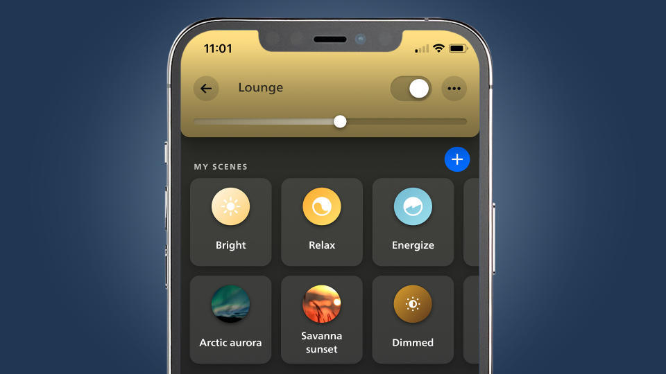 A phone on a blue background showing the Philips Hue app