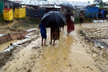 People walk after a storm at Balukhali refugee camp in Cox's Bazar, Bangladesh June 10, 2018.  Kristiana Marton/Save the Children/Handout via REUTERS