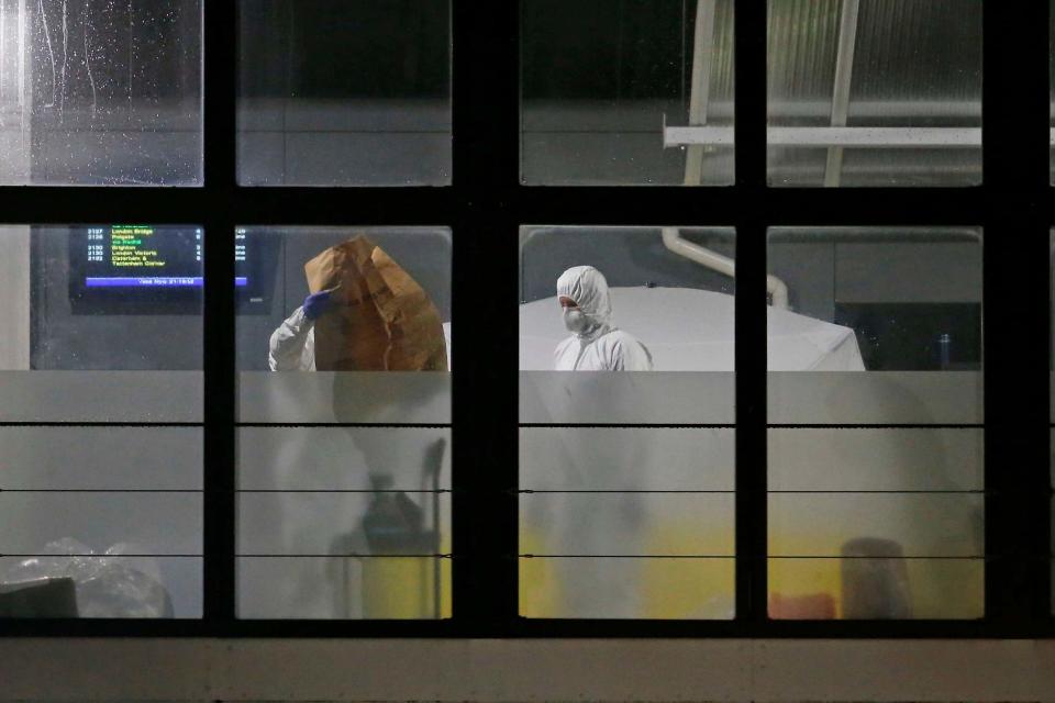 Forensic officers at east Croydon station (NIGEL HOWARD Â©)