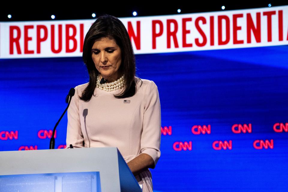 Presidential candidate Nikki Haley looks at her podium during a commercial break of the Republican presidential debate between her and Ron DeSantis at Sheslow Auditorium on the Drake University campus on Wednesday, Jan. 10, 2024, in Des Moines.