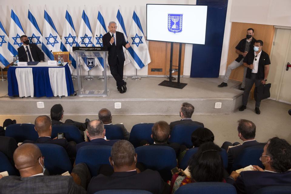 FILE - In this May 19, 2021, file photo, Israeli Prime Minister Benjamin Netanyahu speaks during a briefing to ambassadors to Israel at the Hakirya military base in Tel Aviv, Israel. Netanyahu's political career seemed all but over, but now, as Israel and Gaza’s Hamas rulers wage war, Netanyahu’s fortunes have changed dramatically. His rivals’ prospects have crumbled, Netanyahu is back in his comfortable role as Mr. Security, and the country could soon be headed for yet another election campaign. (AP Photo/Sebastian Scheiner, Pool, File)