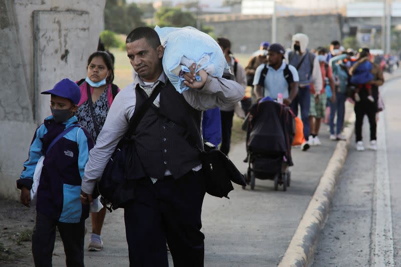 U.S.-bound migrants set off in Honduras in first caravan of 2022, in San Pedro Sula