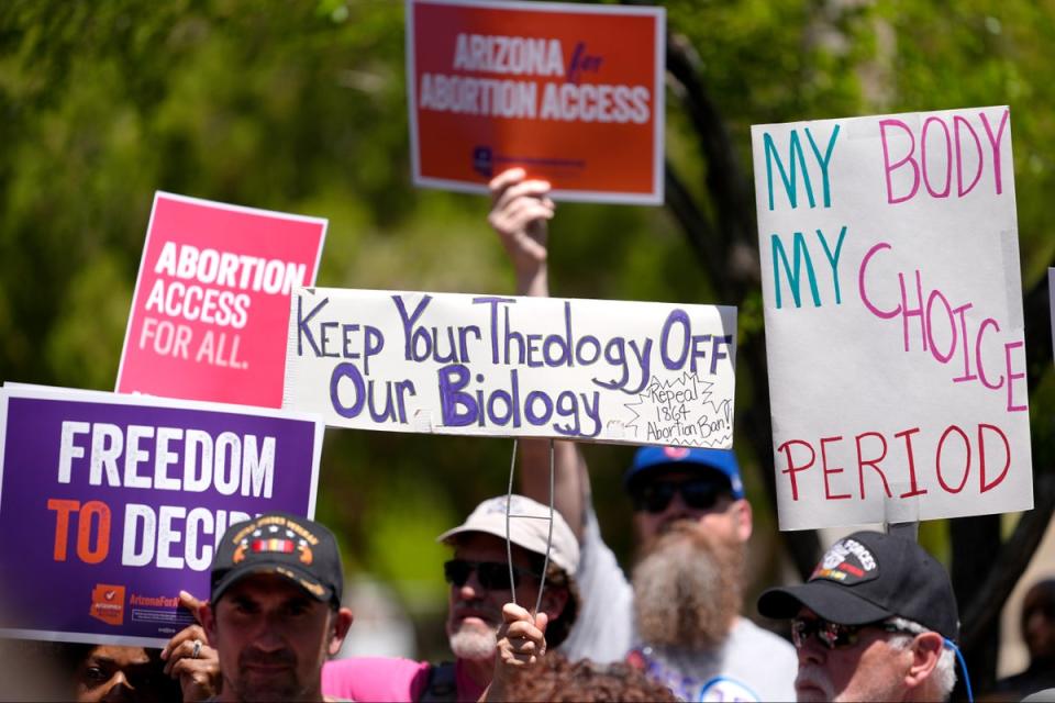 Abortion rights supporters gather outside the Capitol (AP)