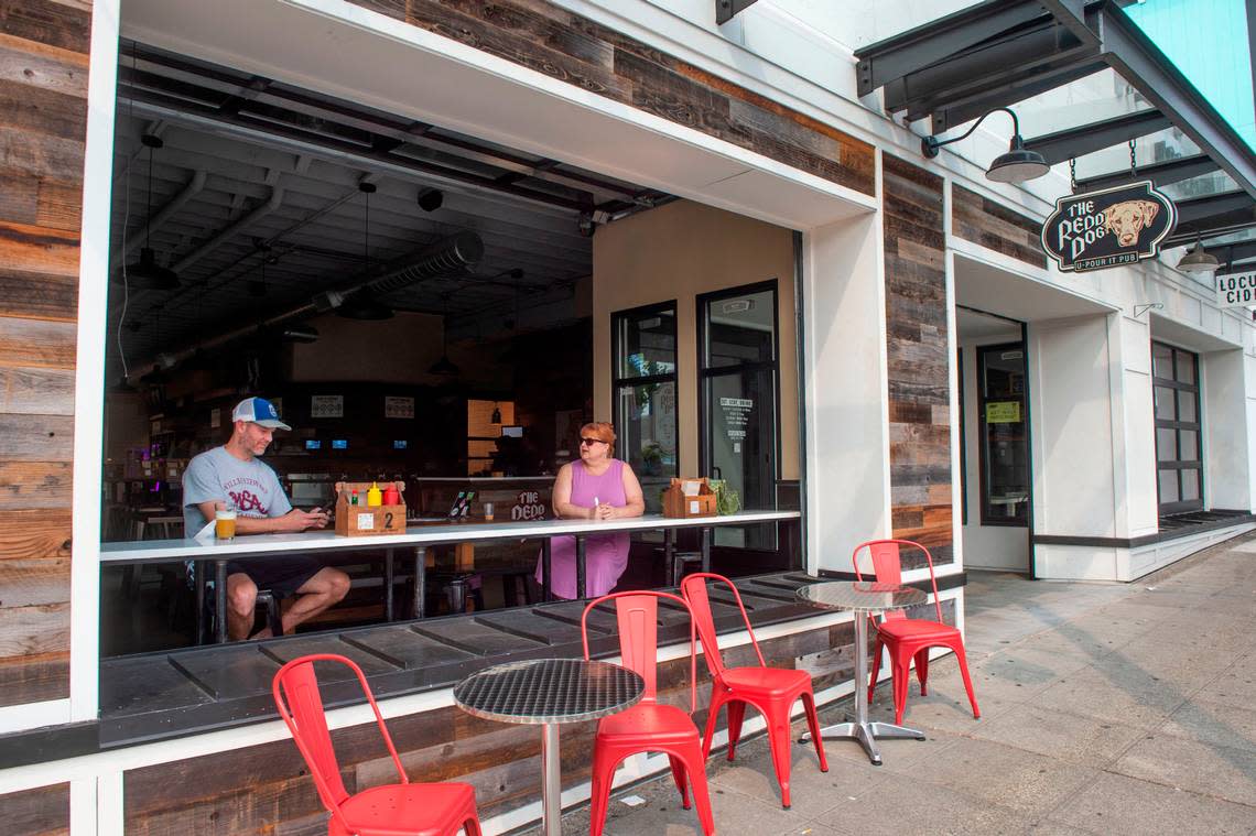 The Redd Dog in Tacoma features a roll-up garage door, a feature the Puyallup location will also offer, as well as a bigger patio.