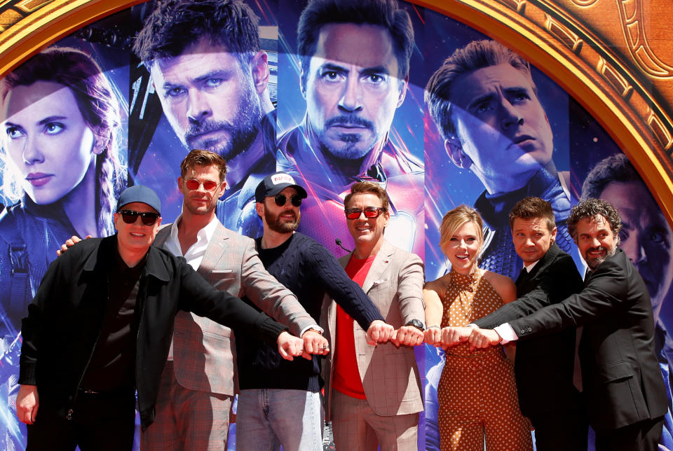 Actors Robert Downey Jr., Chris Evans, Mark Ruffalo, Chris Hemsworth, Scarlett Johansson, Jeremy Renner and Marvel Studios President Kevin Feige pose for a photo at the handprint ceremony at the TCL Chinese Theatre in Hollywood, Los Angeles, California, U.S. April 23, 2019. REUTERS/Mario Anzuoni