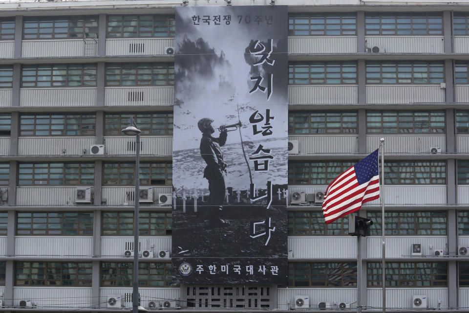 A banner to commemorate the 70th anniversary of the start of the 1950-53 Korean War is displayed after a "Black Lives Matter" banner was taken down at the U.S. Embassy in Seoul, South Korea, Tuesday, June 16, 2020. The large Black Lives Matter banner has been removed from the embassy building, three days after it was raised there in solidarity with protesters back home. The sign reads "Don't forget it." (AP Photo/Ahn Young-joon)