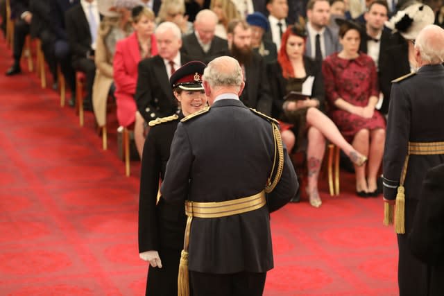 The Prince of Wales presents Major Wetherill with her MBE