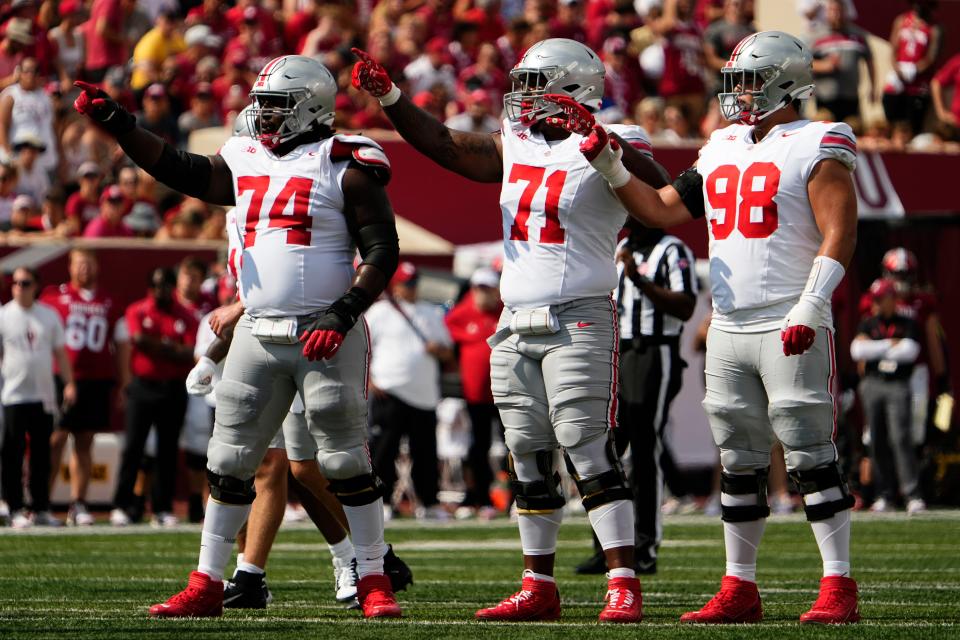 Sep 2, 2023; Bloomington, Indiana, USA; Ohio State Buckeyes offensive lineman Donovan Jackson (74), offensive lineman Josh Simmons (71) and offensive lineman Luke Montgomery (98) set up for a play during the NCAA football game at Indiana University Memorial Stadium. Ohio State won 23-3.