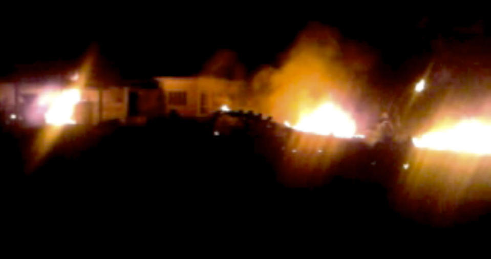 The compound, within which al Qaeda leader Osama bin Laden was killed, is seen in flames after it was attacked in Abbottabad, in this still image taken from video footage from a mobile phone, May 2, 2011. REUTERS/Stringer