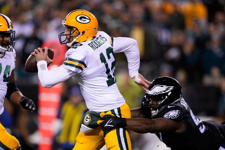 Aaron Rodgers is pressured by the Philadelphia Eagles' Javon Hargrave.