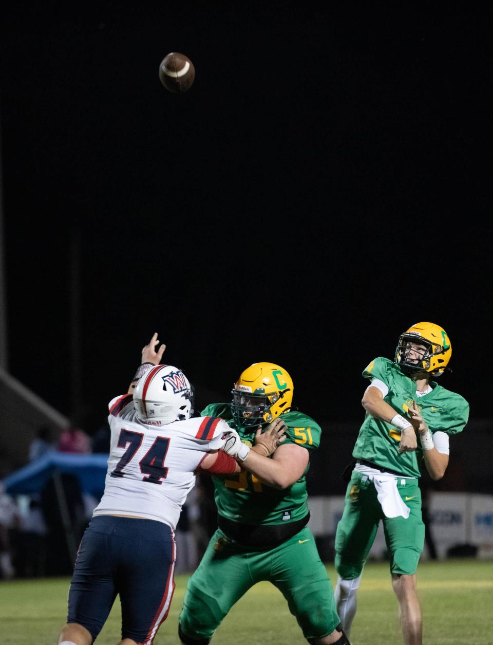 Quarterback Aidan Byrd (3) throws up a pass during the Wakulla vs Catholic football game at Pensacola Catholic High School in Pensacola on Friday, Nov. 11, 2022.